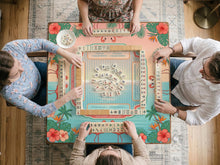 A square aqua mahjong mat with flamingos, palm leaves, and hibiscus flowers in a tropical pattern.