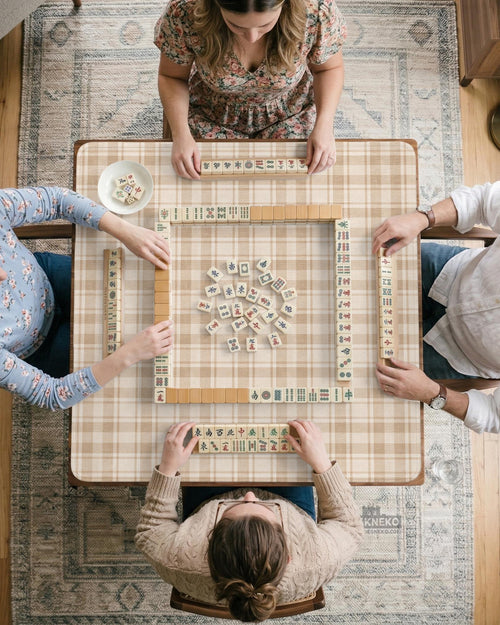 Beige and tan plaid square mahjong mat shown as a large table play surface.
