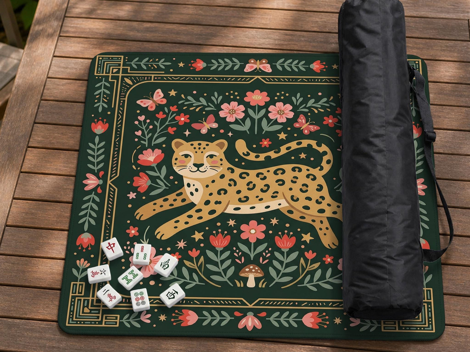 Dark green square mahjong mat with a golden spotted leopard in the center, surrounded by flowers, leafy stems, butterflies, and small star accents.