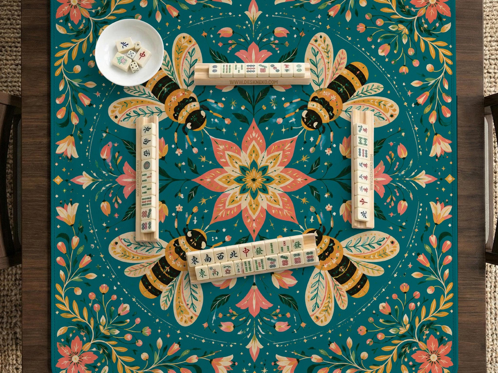 Green mahjong mat with a botanical bee and floral mandala design in teal, coral, cream, and gold.