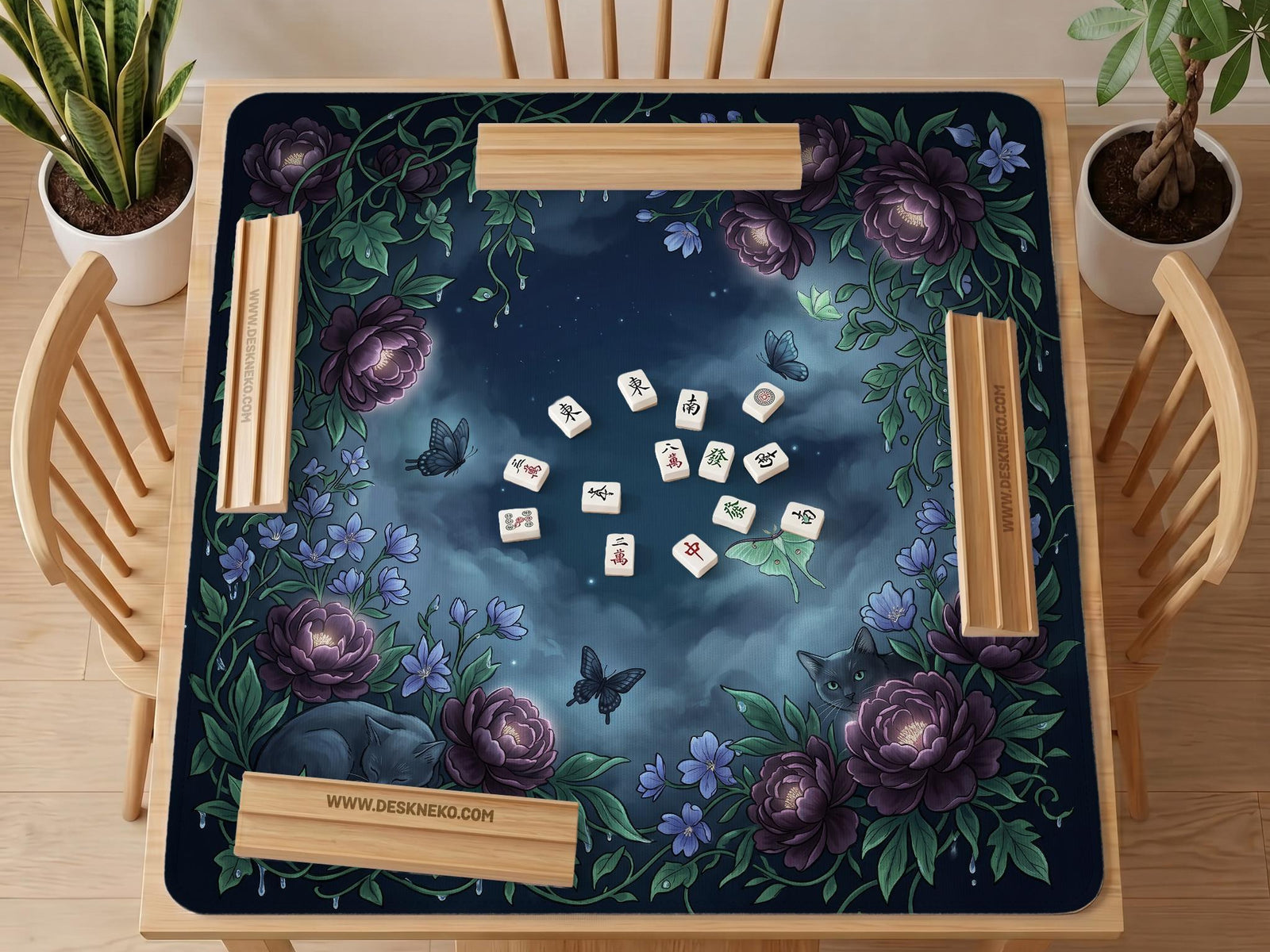 A square mahjong mat with a dark navy background, purple peonies, soft blue flowers, garden vines, butterflies, and small hidden cats around the border.