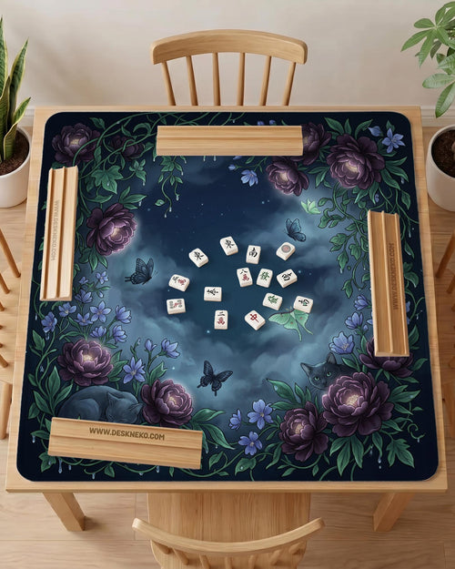 A square mahjong mat with a dark navy background, purple peonies, soft blue flowers, garden vines, butterflies, and small hidden cats around the border.