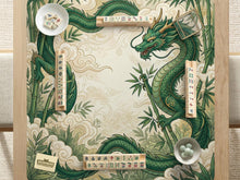 Green square mahjong mat with a dragon border, bamboo artwork, cream cloud details, and an open center.