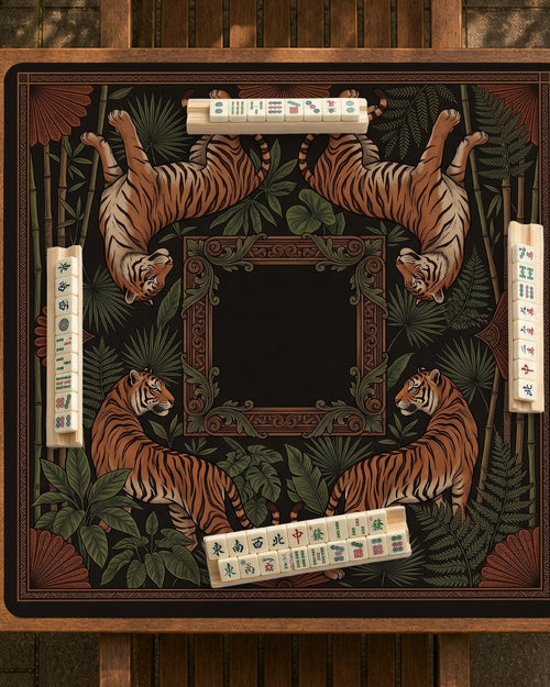 Black square mahjong mat with mirrored tiger faces, bamboo, dark tropical leaves, ornate border details, and orange accents.