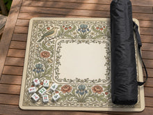 Square mahjong table mat with vintage bird artwork, floral border detail, and sage green, cream, muted blue, and terracotta tones.