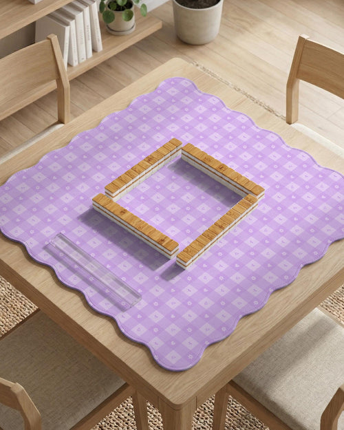Lavender gingham mahjong mat with a scalloped edge and a pastel check pattern.