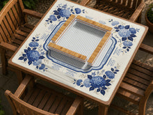 Blue mahjong mat with a hydrangea floral pattern and printed American Mahjong rules and guide text.