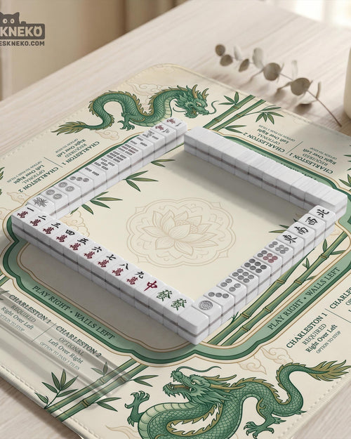 Cream mahjong mat with a green dragon design, bamboo details, and rule prompts along the border.