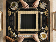 Black and gold square mahjong mat with an art deco crane and floral border, rule reminders around the edges, and a blank center area.