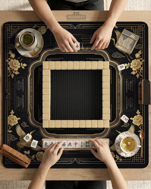 Black and gold square mahjong mat with an art deco crane and floral border, rule reminders around the edges, and a blank center area.