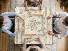 Green mahjong mat with a bamboo pattern, koi fish, crane birds, and ginkgo leaves in a nature-inspired design.