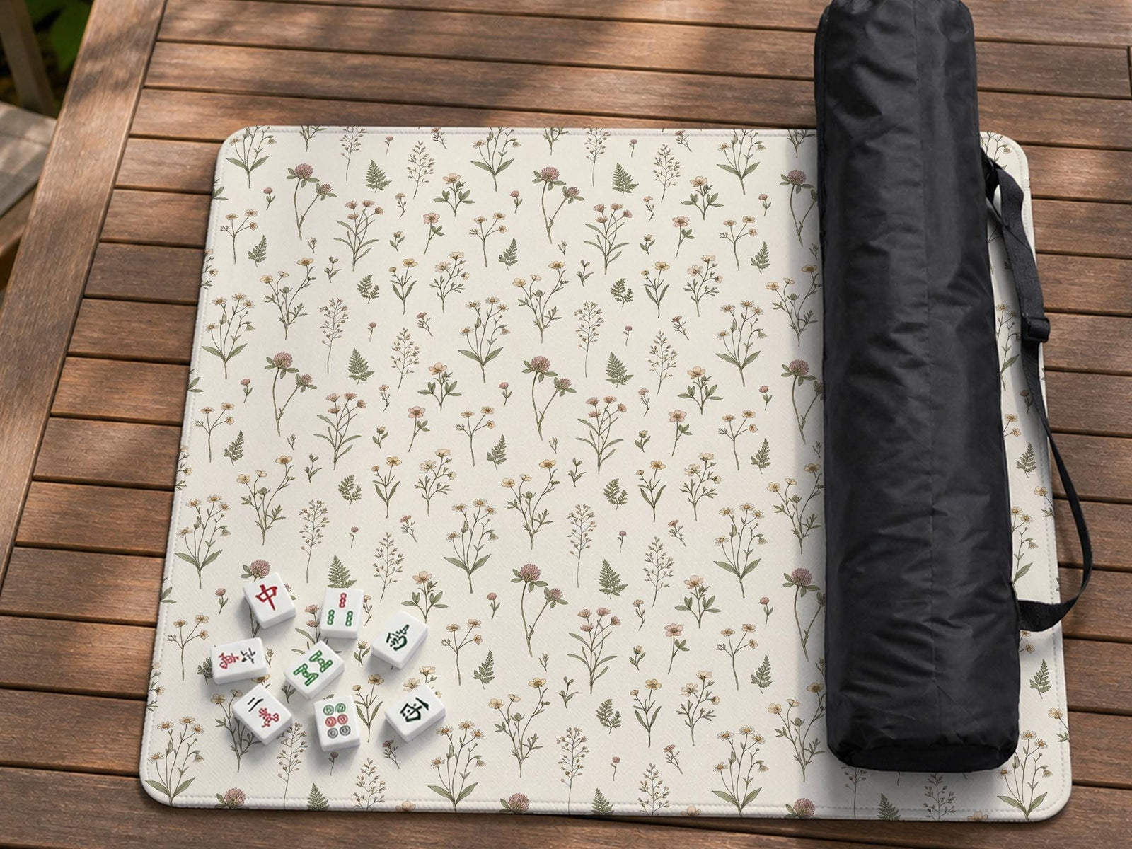 Cream square mahjong mat with a floral pattern of wildflower stems, sage leaves, and small blush blooms.