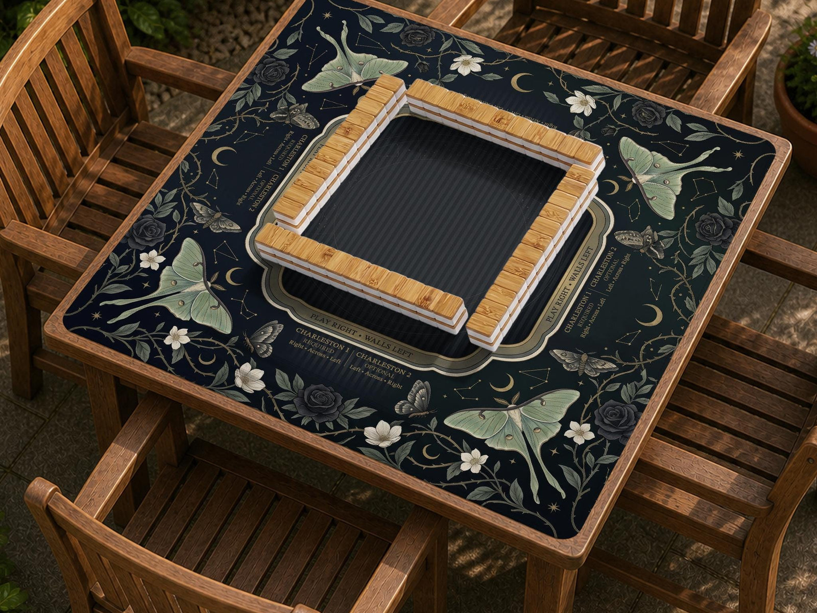 Dark floral mahjong mat with luna moths, moons, and star details in a celestial design.