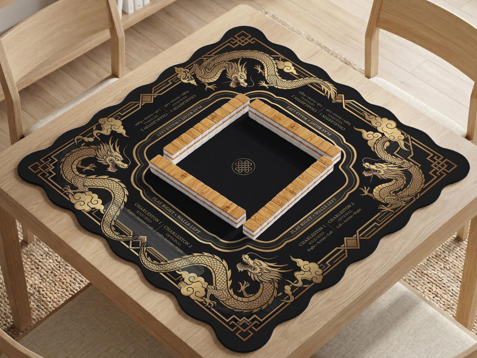 Black mahjong mat with gold dragon artwork, a scalloped edge, and printed Mahjong rules on the surface.