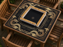 Black mahjong mat with gold dragon artwork, an Art Deco border, and printed Mahjong rules.