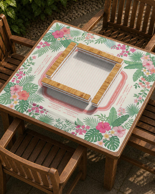 Cream mahjong mat with coral pink hibiscus flowers, green palm leaves, and printed rule zones.