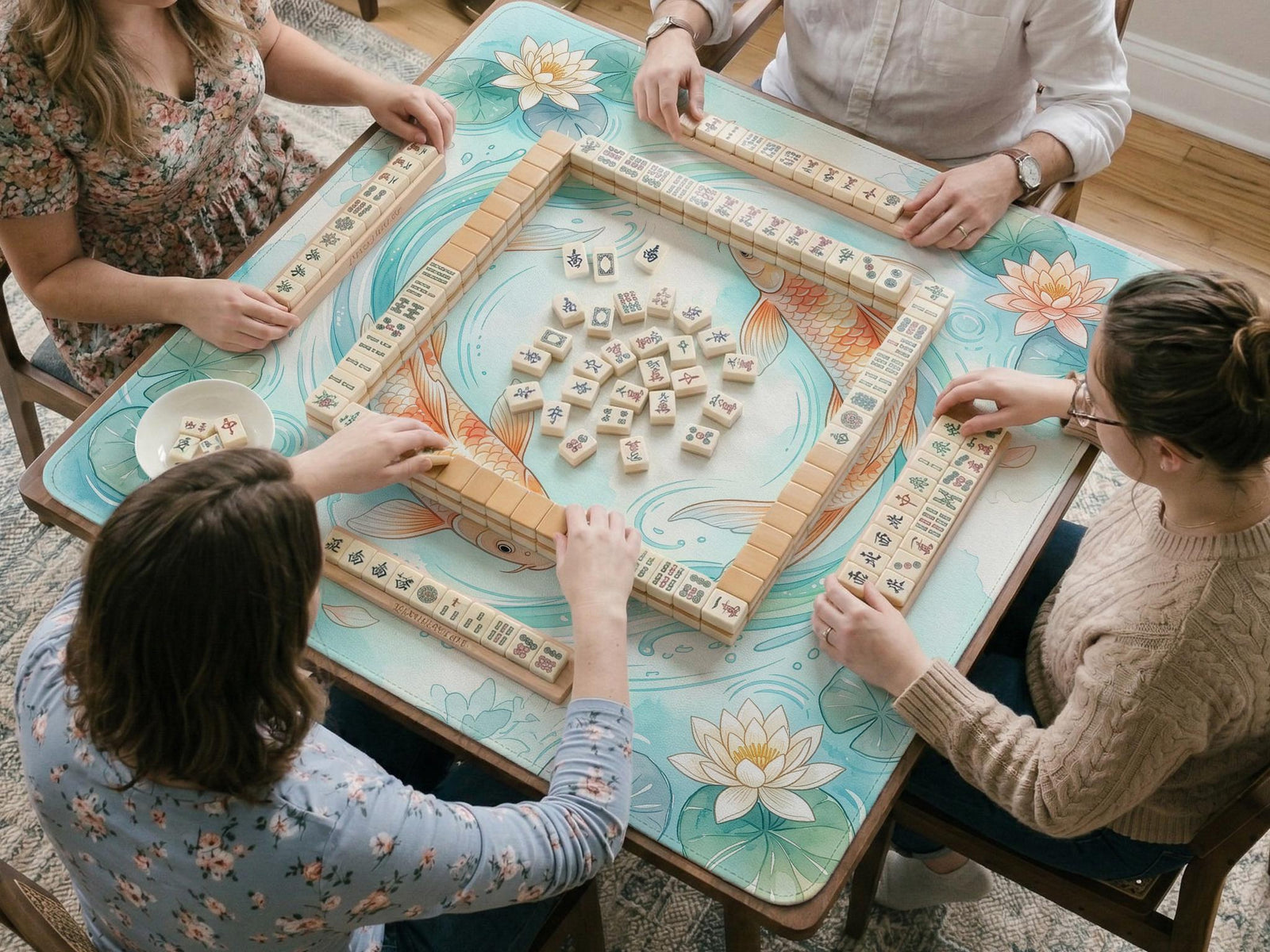 A soft blue mahjong mat with koi fish, floating lily pads, pale floral details, and a watercolor-style pond design.