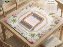 Pink mahjong mat with hibiscus flowers, palm leaves, a sage border, and a striped center area.