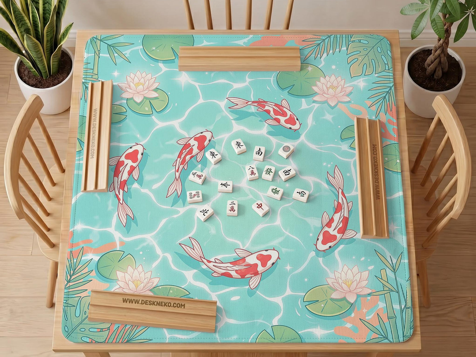 Turquoise square mahjong mat with koi fish, floating lily pads, pale lotus flowers, and green pond plants.