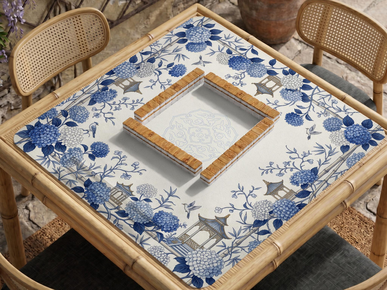 Blue and white square mahjong mat with a hydrangea and bird botanical border and a plain center area.