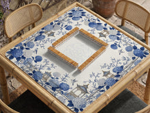Blue and white square mahjong mat with a hydrangea and bird botanical border and a plain center area.