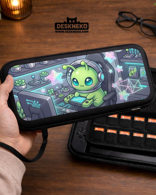 A Switch carrying case design with a cute green alien at a gaming desk, glowing cyan lights, and pastel stars on a dark background.