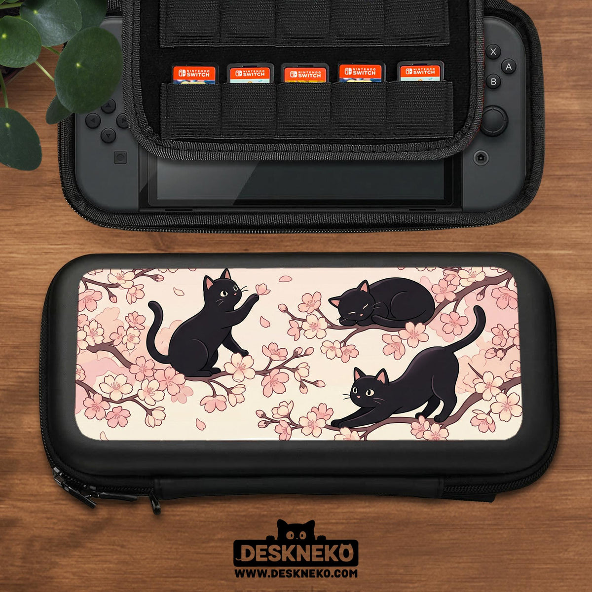 Switch case with black cats and cherry blossoms on a light pastel background.