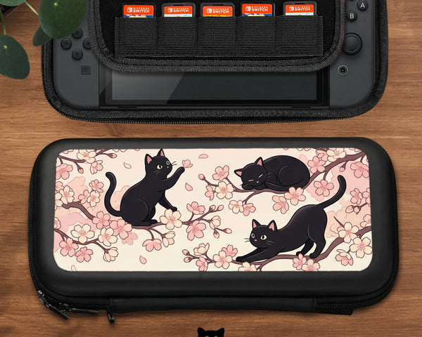 Switch case with black cats and cherry blossoms on a light pastel background.