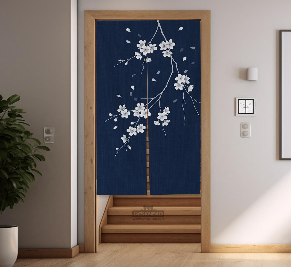 Navy door curtain with pink cherry blossom branches and a light floral layout on a dark background.