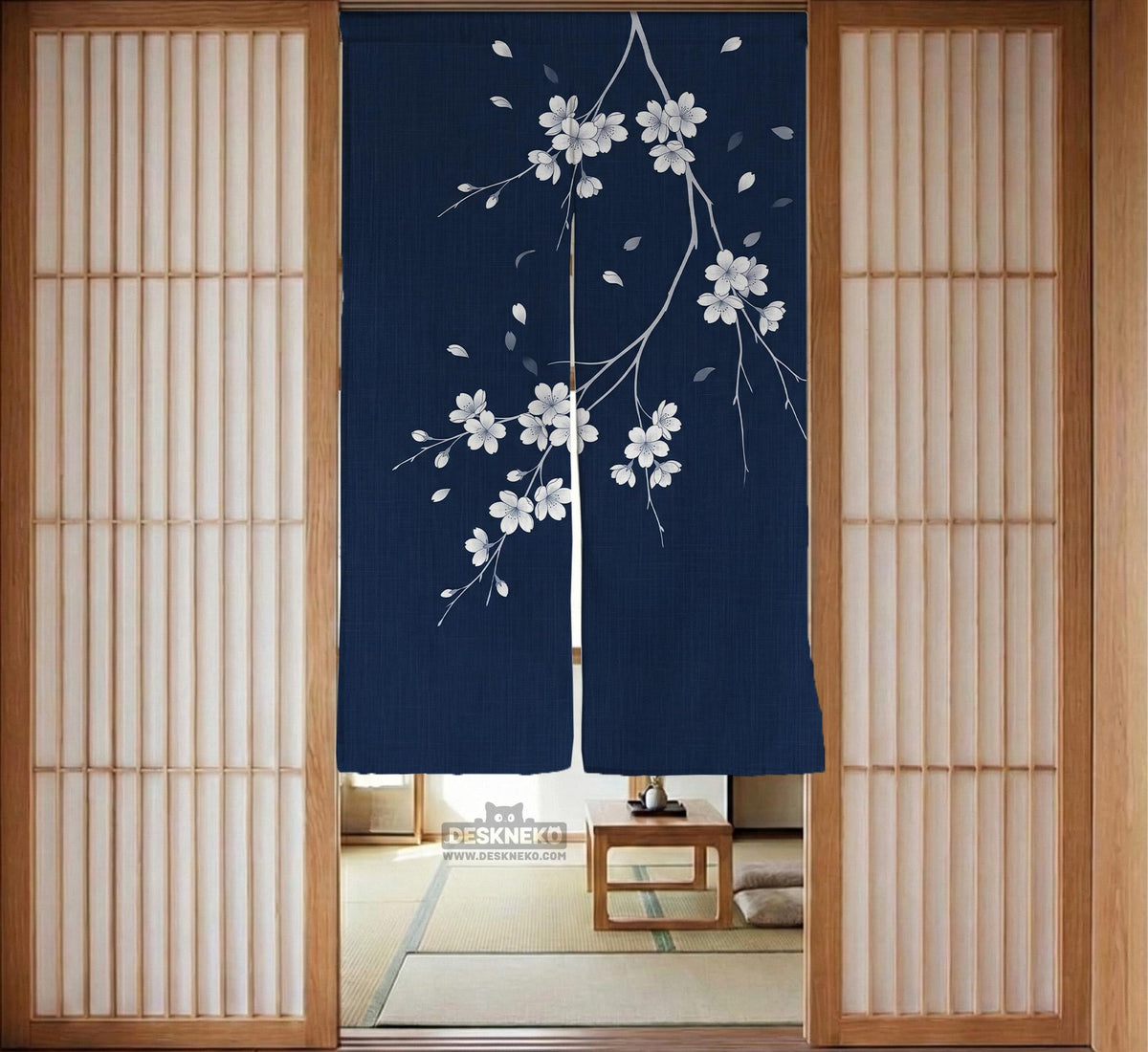 Navy door curtain with pink cherry blossom branches and a light floral layout on a dark background.