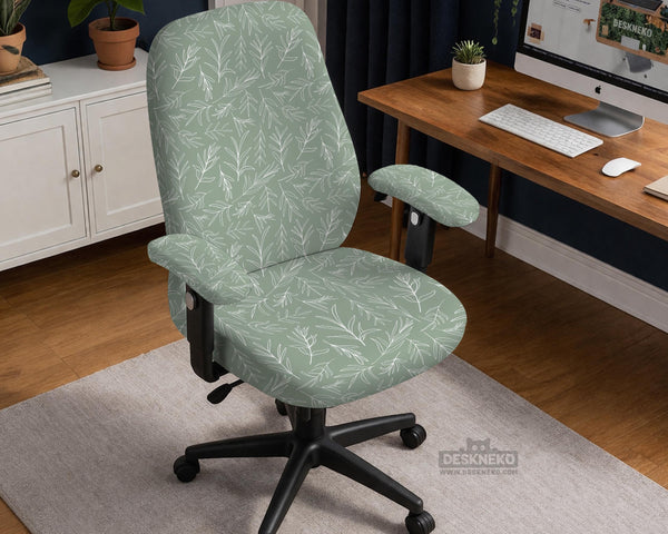 Office chair cover in muted sage green with a light leaf pattern on a white background.