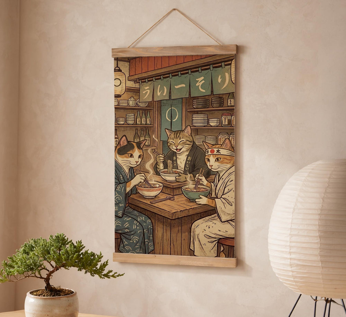 A split-panel Japanese noren curtain showing a ramen shop scene with three cats, warm lantern light, and vintage-style artwork in beige, muted teal, and brown tones.