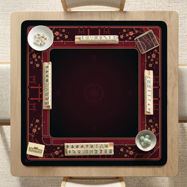 Square burgundy mahjong mat with a cherry blossom floral border and a dark open center.