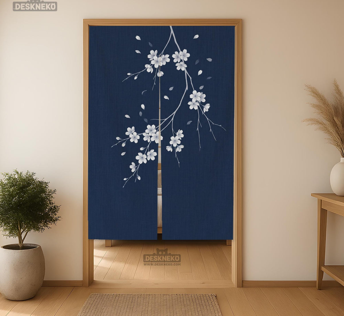 Navy door curtain with pink cherry blossom branches and a light floral layout on a dark background.