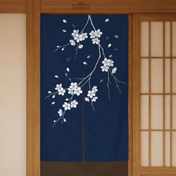 Navy door curtain with pink cherry blossom branches and a light floral layout on a dark background.