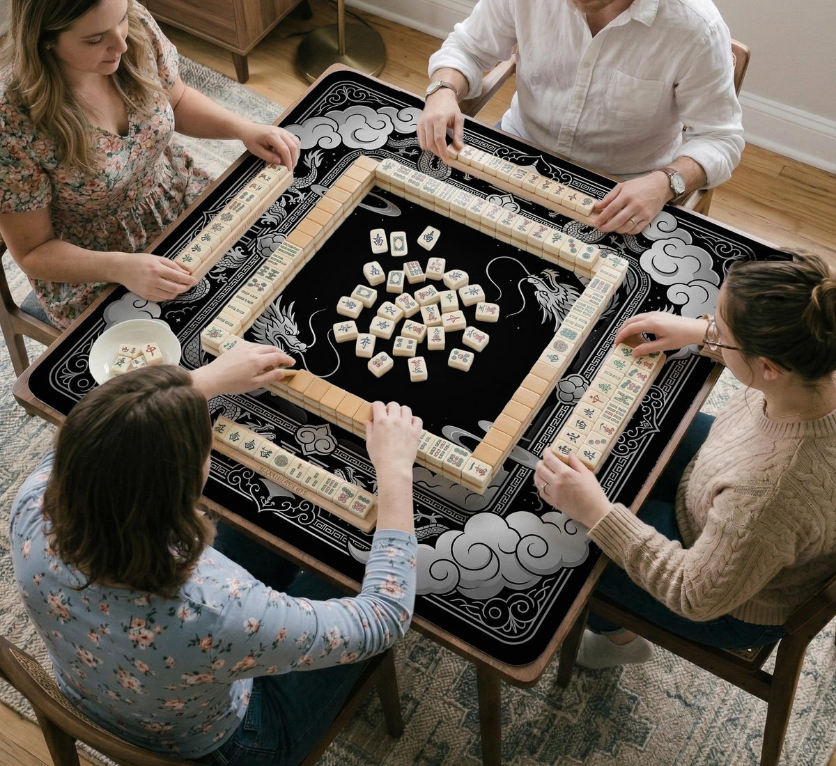Square mahjong table mat with a black and silver dragon border, cloud details, and a scalloped edge.