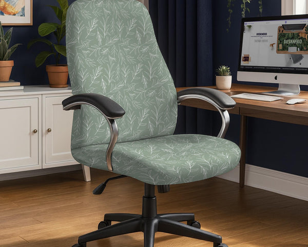 Office chair cover in muted sage green with a light leaf pattern on a white background.