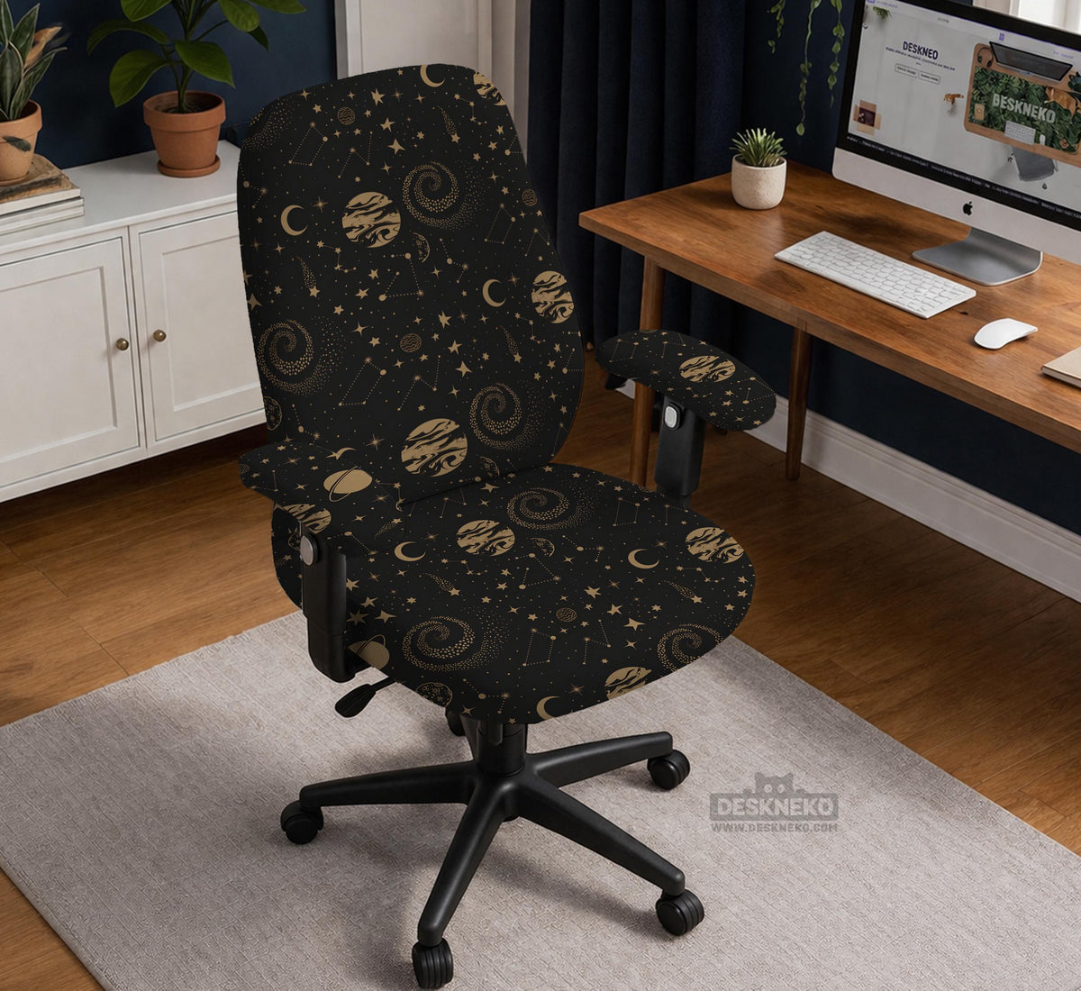 Black chair cover with a dark galaxy pattern, muted gold stars and celestial artwork on a chair.