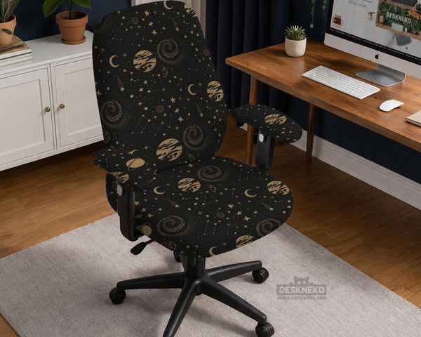 Black chair cover with a dark galaxy pattern, muted gold stars and celestial artwork on a chair.