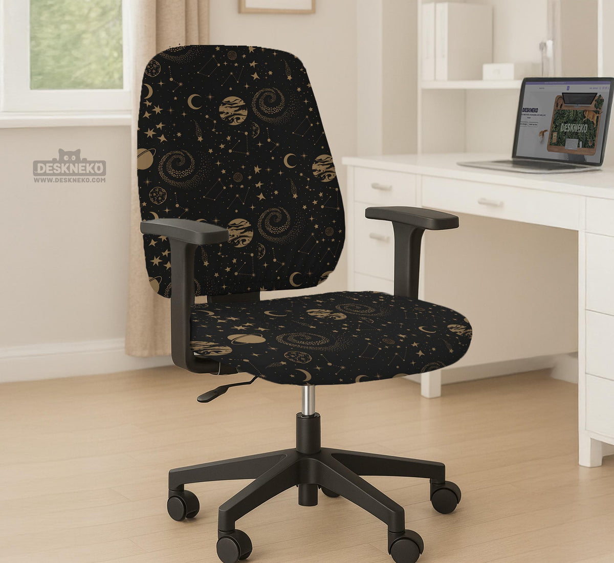 Black chair cover with a dark galaxy pattern, muted gold stars and celestial artwork on a chair.