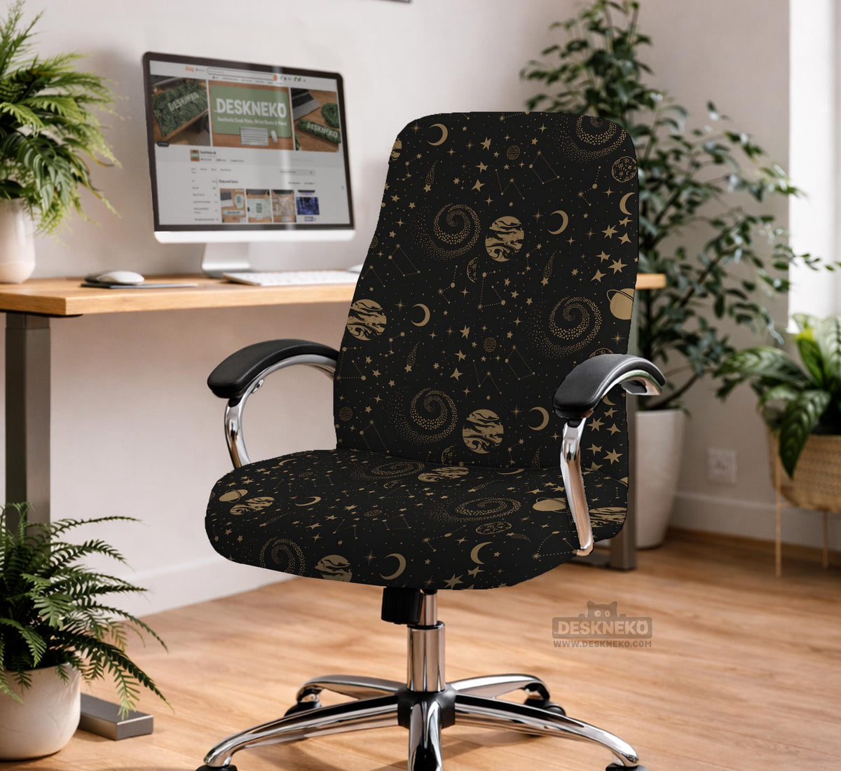 Black chair cover with a dark galaxy pattern, muted gold stars and celestial artwork on a chair.