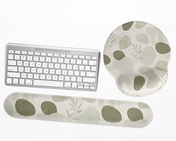 Green abstract botanical mouse pad with a rounded organic pattern and matching keyboard wrist rest option.