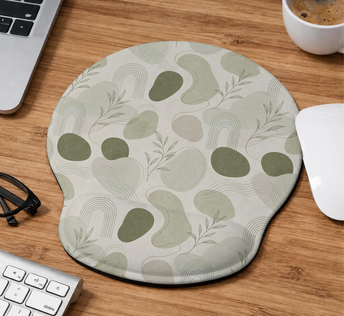 Green abstract botanical mouse pad with a rounded organic pattern and matching keyboard wrist rest option.