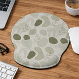 Green abstract botanical mouse pad with a rounded organic pattern and matching keyboard wrist rest option.