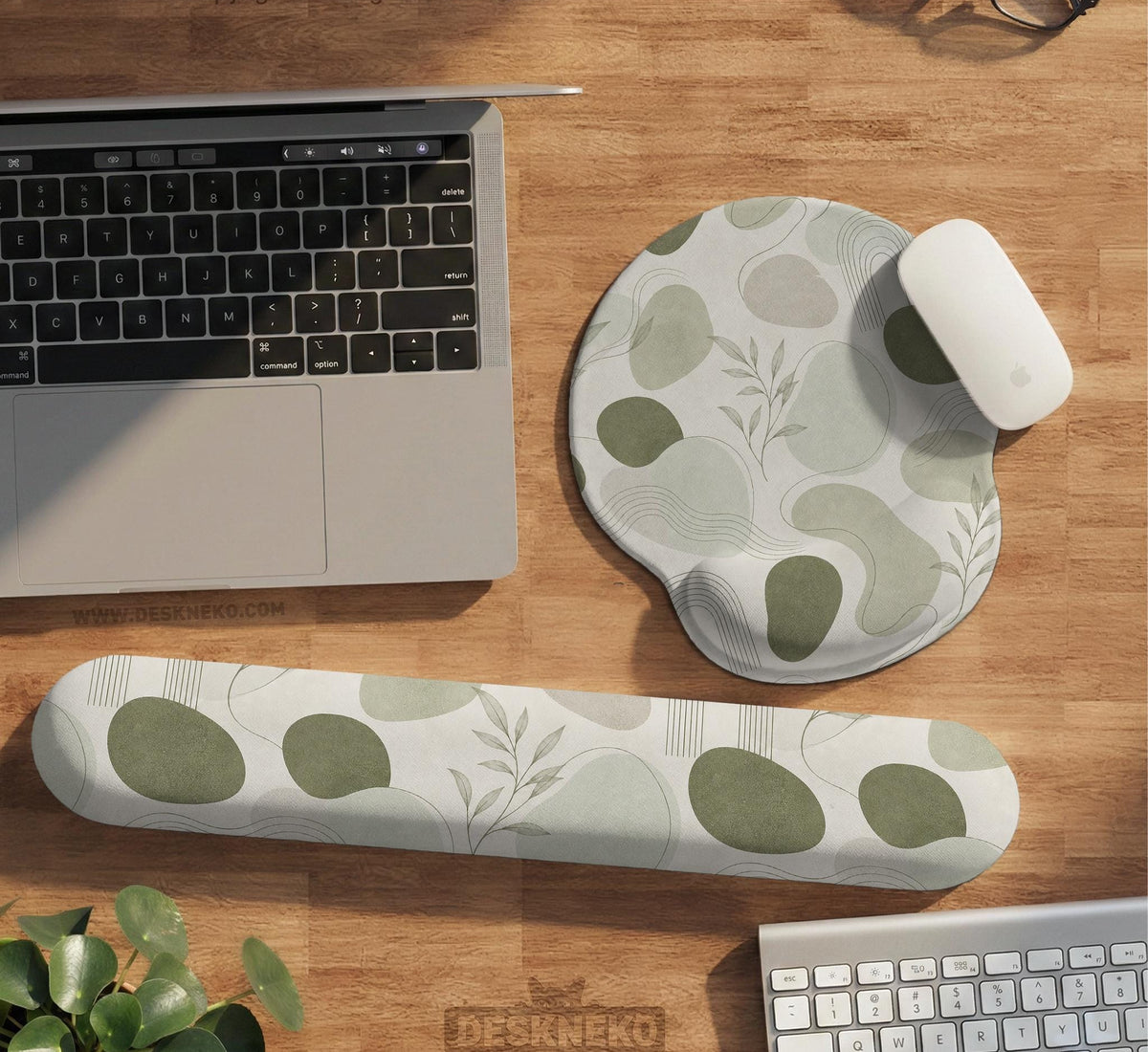 Green abstract botanical mouse pad with a rounded organic pattern and matching keyboard wrist rest option.