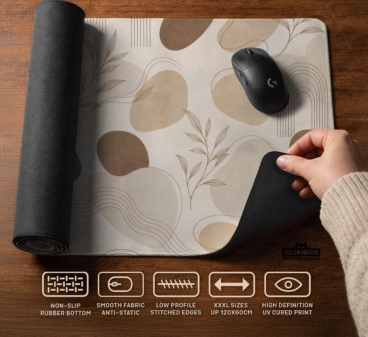 Beige desk mat with fine botanical line drawings and soft abstract shapes on a light neutral background.