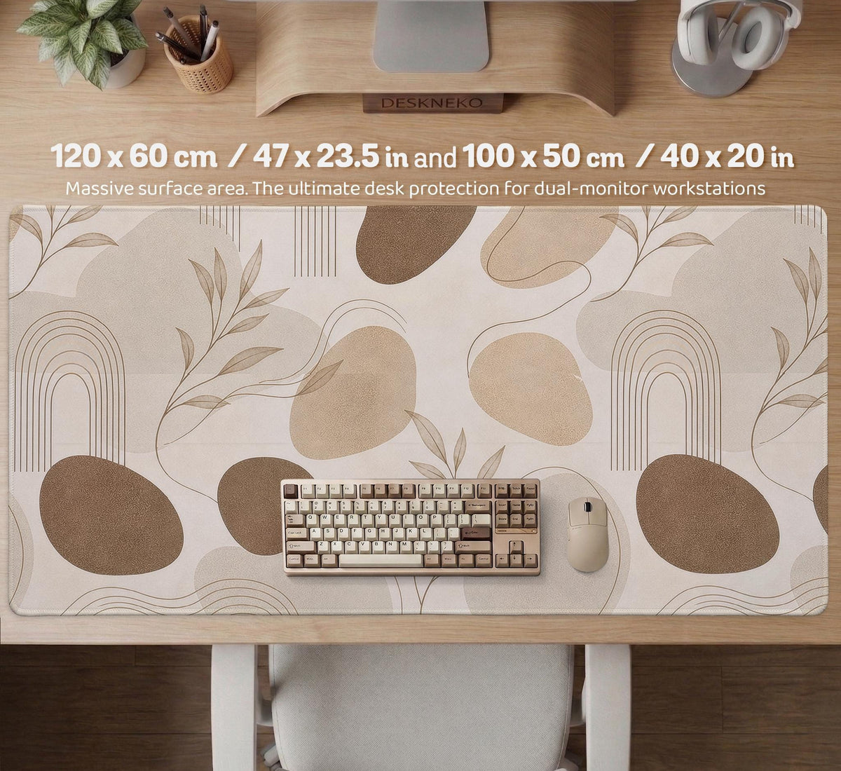 Beige desk mat with fine botanical line drawings and soft abstract shapes on a light neutral background.