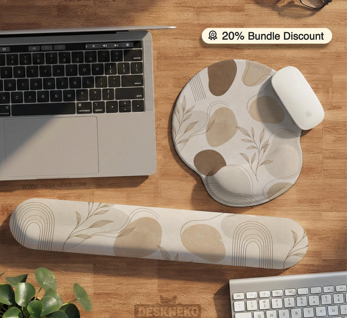 Beige desk mat with fine botanical line drawings and soft abstract shapes on a light neutral background.