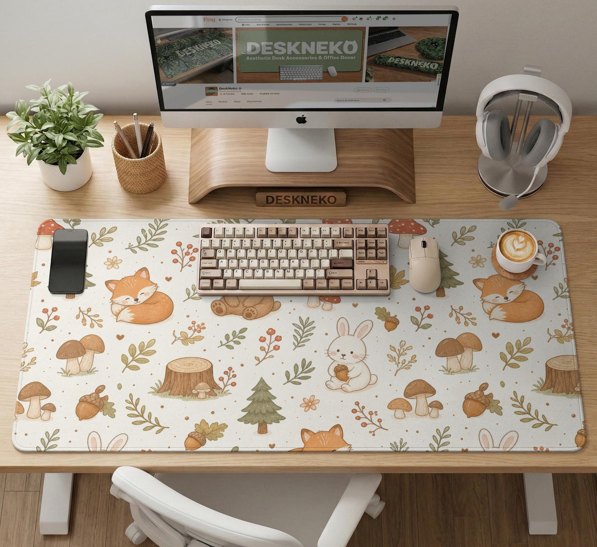 Cream desk mat with a woodland animal pattern featuring foxes, bunnies, mushrooms, berries, acorns, and sage leaves in soft green tones.