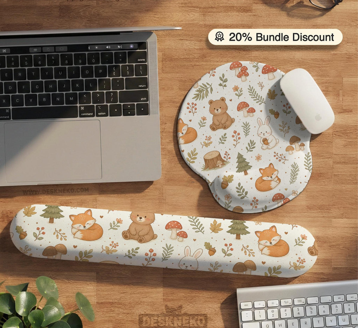Cream desk mat with a woodland animal pattern featuring foxes, bunnies, mushrooms, berries, acorns, and sage leaves in soft green tones.